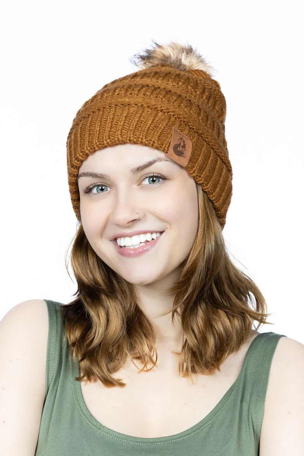 Smiling woman wearing Sequoia ribbed knit beanie with pom
