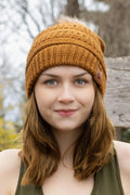 Woman wearing Sequoia ribbed knit beanie with pom outdoors